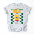 White t-shirt with a colorful design featuring a pencil character and text "Catholic Central Irish" on a white background